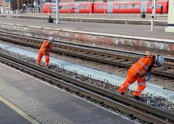 Workers at Gatwick Airport Station adhere to social distancing rules