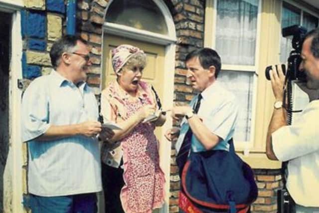 Jim in an early scene with Liz Dawn and Bill Tarmey on the set of Coronation Street SUS-200519-161400001