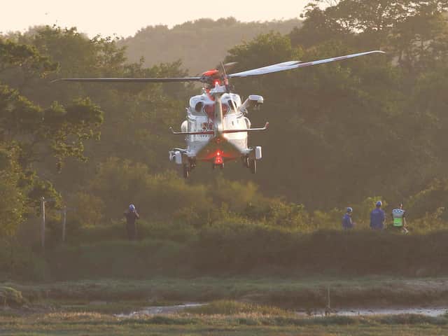Emergency services were called to Pagham Nature Reserve after reports of an injured woman stuck in the mud