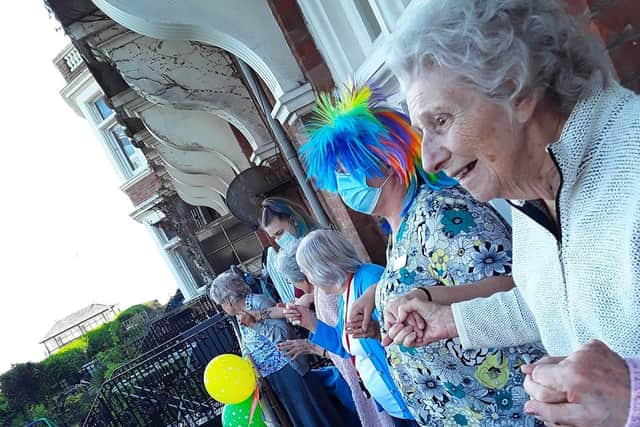 Singer Ritchie Lee performing on the patio of Grosvenor House Care Home in St Leonards during the UK's lockdown. SUS-201005-092016001