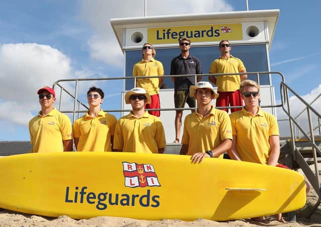 RNLI lifeguards at Camber Sands last August. Picture by Kt Bruce SUS-200528-120628001