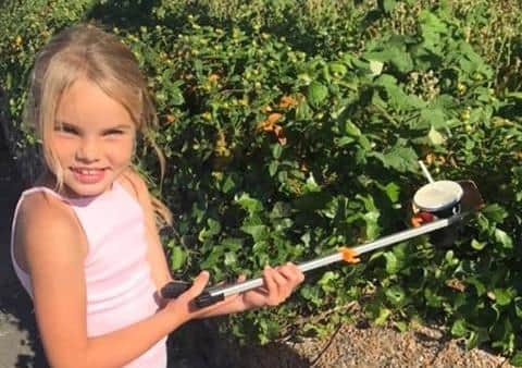 Gracie Baker, eight, from Goring, has been picking up litter on the seafront near her home