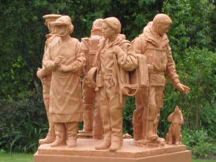 A maquette showing the side of the sculpture with the NHS workers.