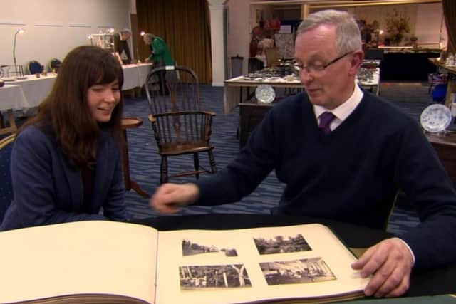 Bargain Hunt presenter Natasha Raskin Sharp learns about the collection of early photographs, documenting Robert Henderson's world tour in 1874, from Jeremy Knight, Horsham museum and heritage manager. Picture: BBC