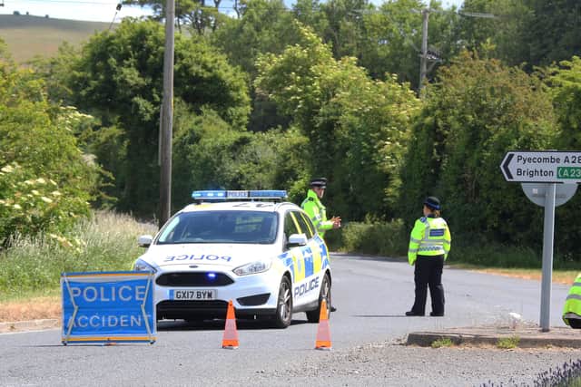Officers at the scene of the collision on the A281