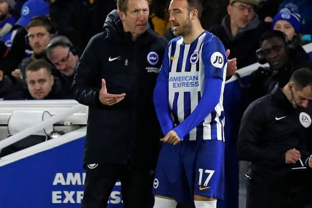 Brighton and Hove Albion head coach Graham Potter and striker Glenn Murray discuss tactics during a substitution at the Amex Stadium