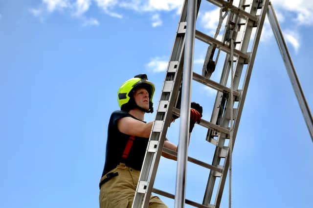 Firefighters at East Grinstead fire station completed a Mount Everest challenge for charity. Picture: Niamh Slatter