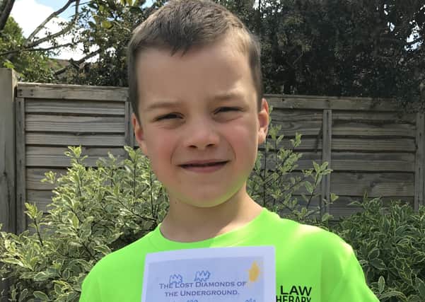 Harry Law, aged seven, from Billingshurst has written and illustarted a book to raise funds for the NHS SUS-200906-131557001