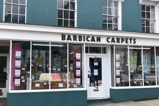 Barbican Carpets in Lewes. Picture by Clare Crouch, Lewes Chamber of Commerce president and Ashley Price, chamber secretary