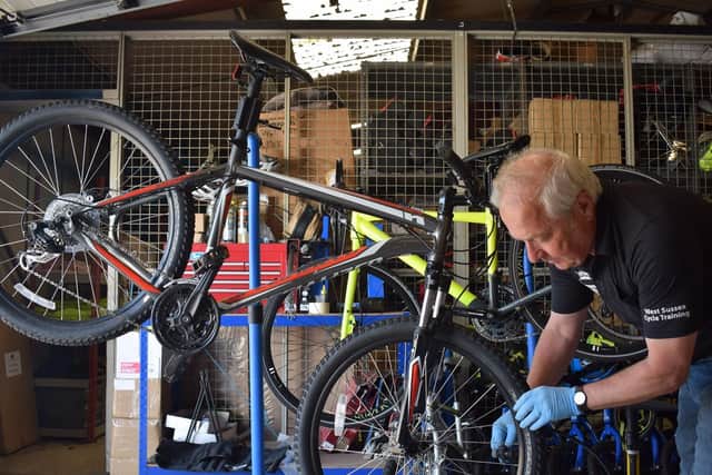Bikeability Instructor Martin Child renovating a bicycle destined for an NHS worker SUS-200615-142536001
