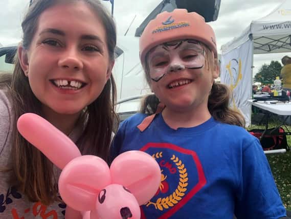 Hollie with her cousinCarmela (right), who suffers from a rare form of muscular dystrophy, called LMNA Congenital Muscular Dystrophy