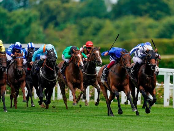Circus Maximus and Ryan Moore, right of picture, on their way to victory in the Queen Anne Stakes / Picture: Alan Crowhurst, Getty