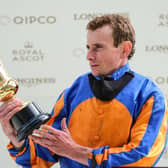 Ryan Moore admires The Queen's Vase after his win on Santiago / Picture: Getty