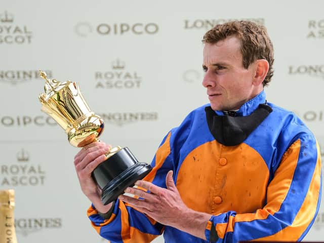 Ryan Moore admires The Queen's Vase after his win on Santiago / Picture: Getty