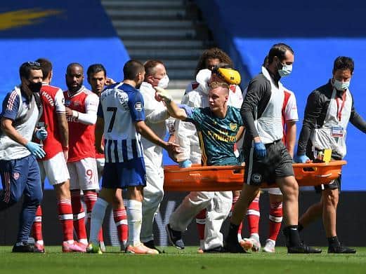 Leno is seriously upset with Neal Maupay as the goalkeeper is stretchered off after colliding with the Albion striker