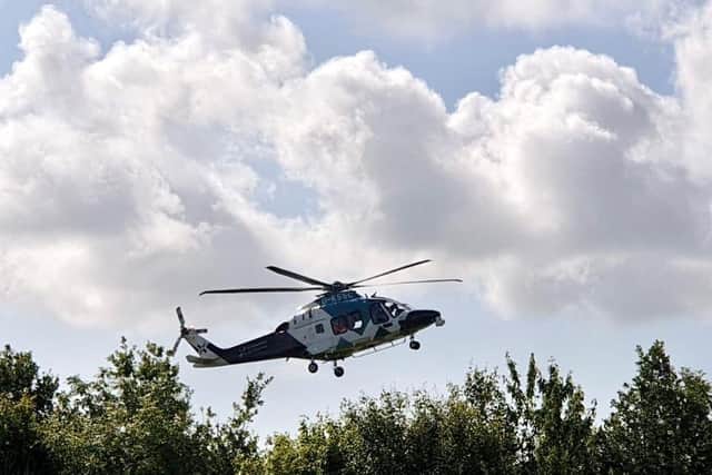 Anair ambulance has been pictured landing at the scene