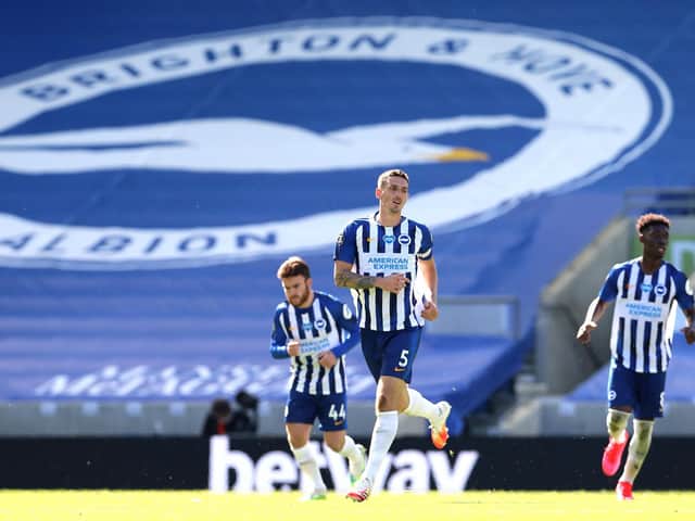 Big ground, no fans: Lewis Dunk at the near-empty Amex during Brighton's win over Arsenal / Picture: Getty