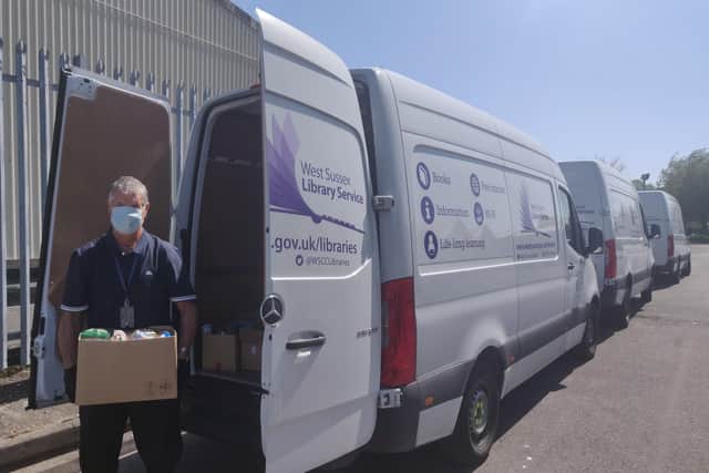 Food parcels being packed into a West Sussex Libraries van for delivery