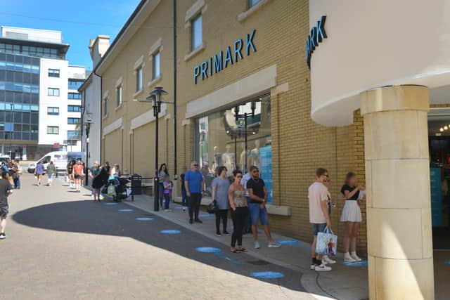 People form a queue outside Primark in Hastings town centre 15/6/20 SUS-200615-122326001