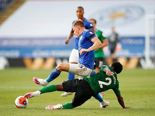 Tariq Lamptey gets stuck into Jamie Vardy at the King Power Stadium