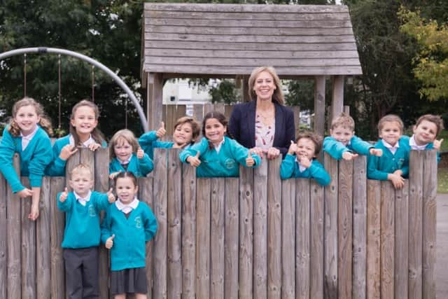 Henfield Primary head Denise Maurice with pupils, pictured before lockdown
