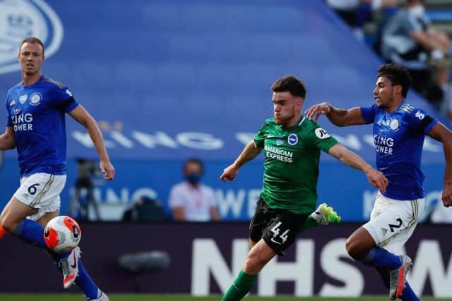 Brighton striker Aaron Connolly is hauled down fr the penalty against Leicester at the King Power Stadium