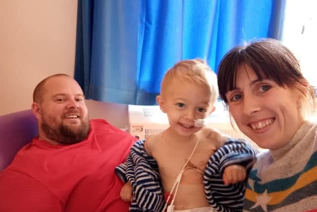 Two-year-old George with parents Darren and Roxanne Pannell