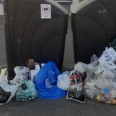 Rubbish piled up next to bins in Littlehampton