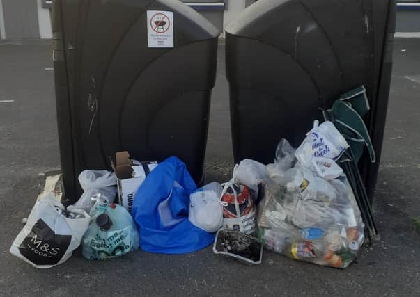 Rubbish piled up next to bins in Littlehampton