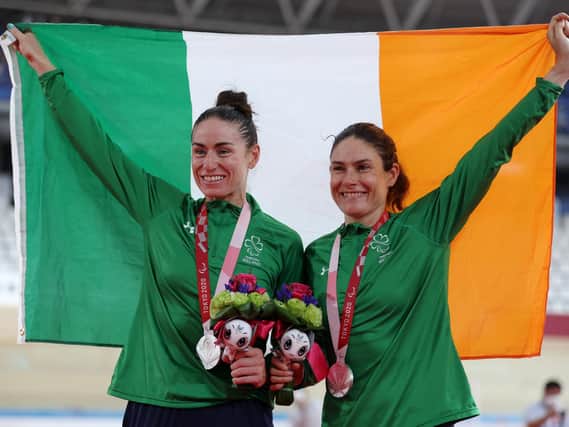 Silver medallists Katie-George Dunlevy (right) and pilot Eve McCrystal pose during the women’s B 3,000m individual pursuit medal ceremony. Picture by Kiyoshi Ota/Getty Images