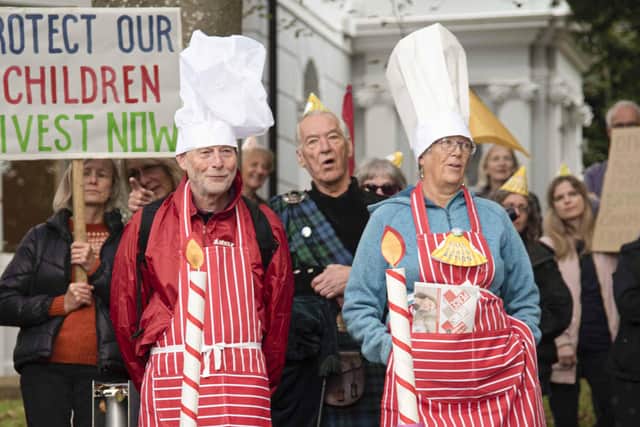Climate campaigners deliver a giant ‘Two years of climate fudge’ cake to County Hall, Lewes on 12 October 2021. PHOTO: Katie Vandyck