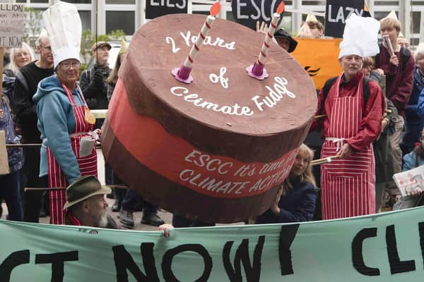 Climate campaigners deliver a giant ‘Two years of climate fudge’ cake to County Hall, Lewes on 12 October 2021. PHOTO: Katie Vandyck