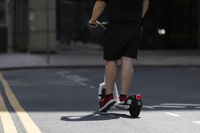 A person on an electric scooter (Photo by Dan Kitwood/Getty Images) SUS-210927-113010001