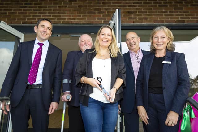 MP Mims Davies (centre) cut the ribbon at a ceremony marking the transfer of Kings Weald Community Building from Croudace to Mid Sussex District Council