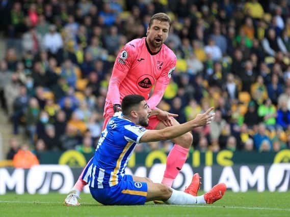 Albion striker Neal Maupay and Norwich keeper Tim Krul clash at Carrow Road