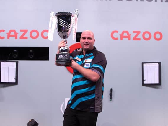 Rob Cross lifts the trophy / Picture: Kais Bodensieck - PDC Europe