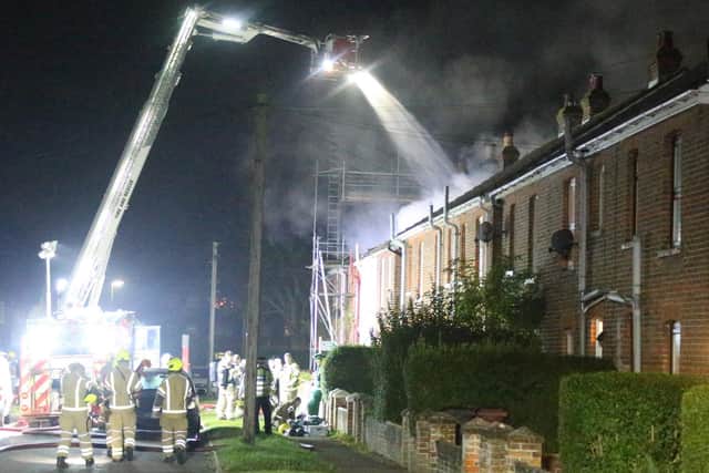 Firefighters spent hours battling a blaze in a terraced house, which damaged three properties. Photo: Eddie Mitchell