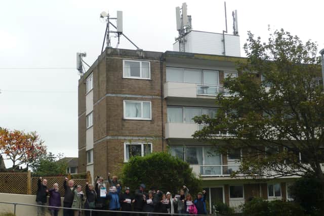 Objectors outside Cumberland Court in Bexhill SUS-211020-104013001