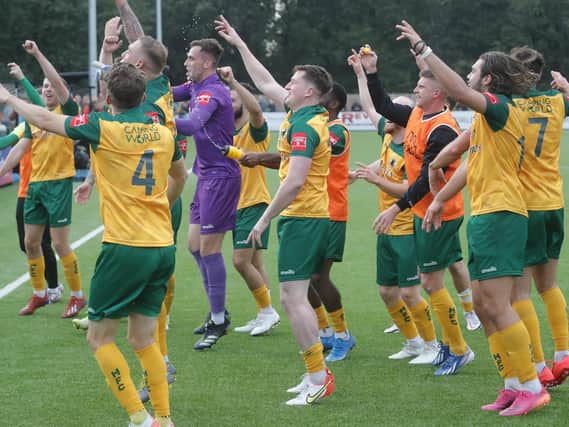 The Horsham players celebrate beating Woking / Picture: John Lines