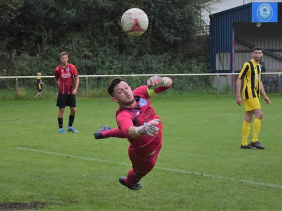 The Loxwood keeps out one AFC Uckfield effort - but the Oakmen won the SCFL clash 3-1 / Picture: Mike Skinner