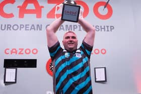 Rob Cross lifts the trophy / Picture: Kais Bodensieck/PDC Europe