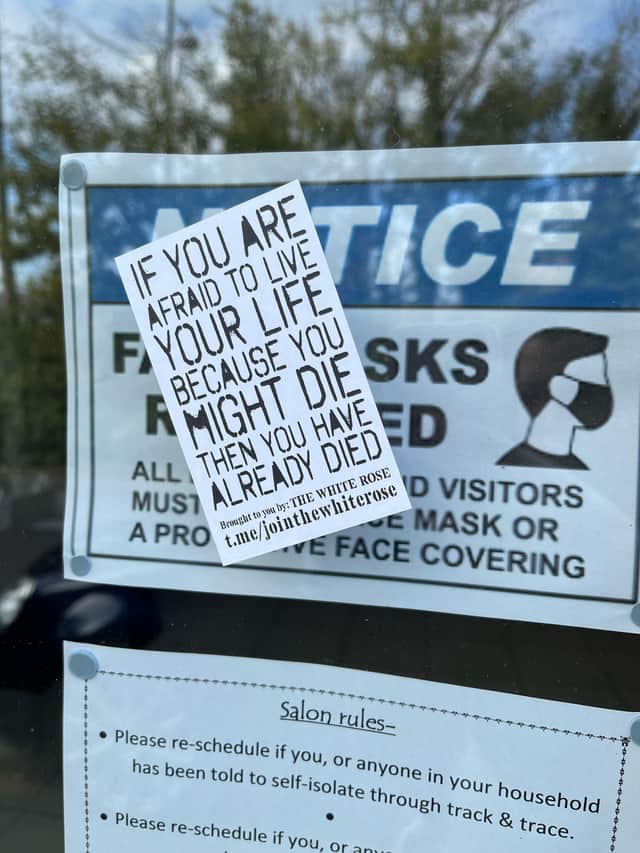 The stickers appeared on a Chichester hairdressers Sunday morning before being removed