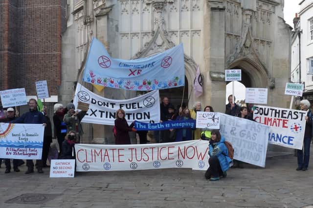 A climate protest at Chichester's Market Cross on Friday