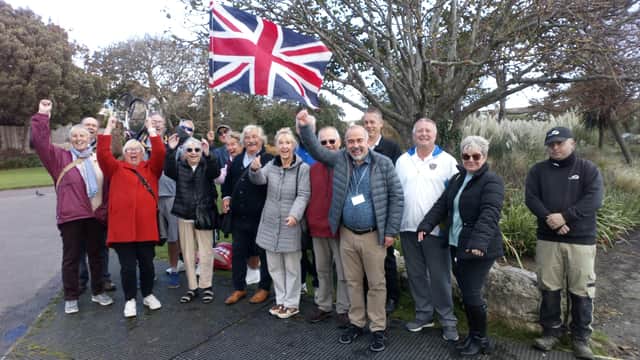 RDC councillors Doug Oliver, Hazel Timpe, Christine Bayliss and Paul Courtel celebrate the achievement with  grounds maintenance contractor idverde and representatives from Bexhill Tennis Club, Spartan and Lakeside Bowls Club, and Bexhill in Bloom volunteers SUS-211025-132237001