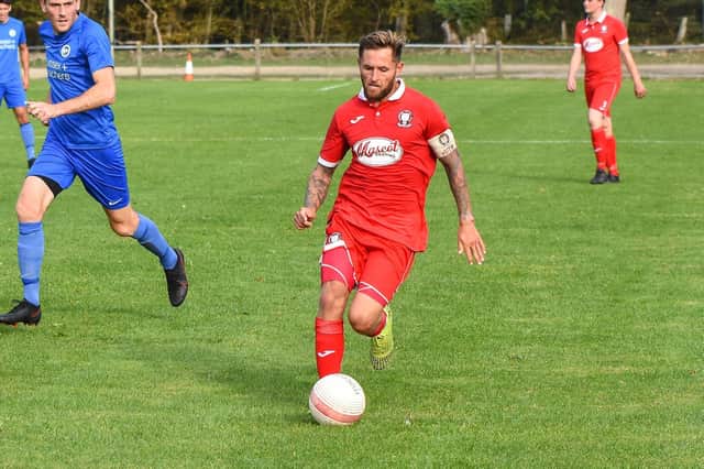 Bradley Bant was in the thick of the action for Hassocks in their SCFL Premier defeat to Loxwood. Picture by Chris Neal
