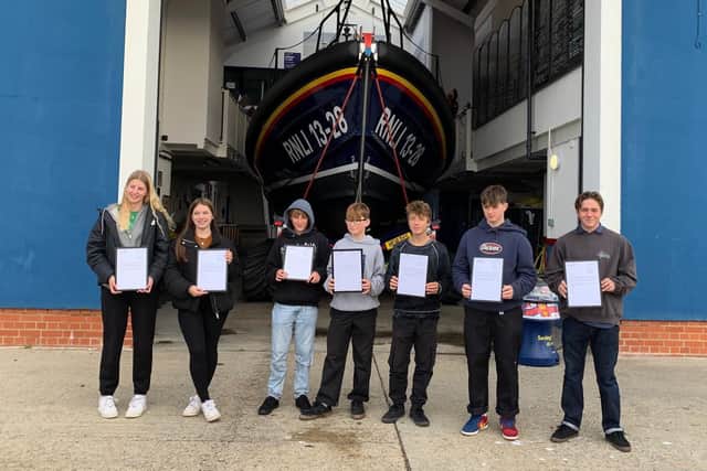 Teenagers Millie Marchant, Emma Sandeman, Oscar Howitt, George Mummery, Ben Sandeman, Sonny Flynn, and Louis Lewis helped save the lives of two swimmers off Hastings SUS-211027-103612001