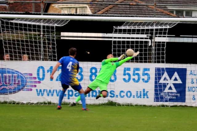 Lewis Boughton makes a save in Pagham's shootout win over Snodland in the FA Vase / Picture: Roger Smith
