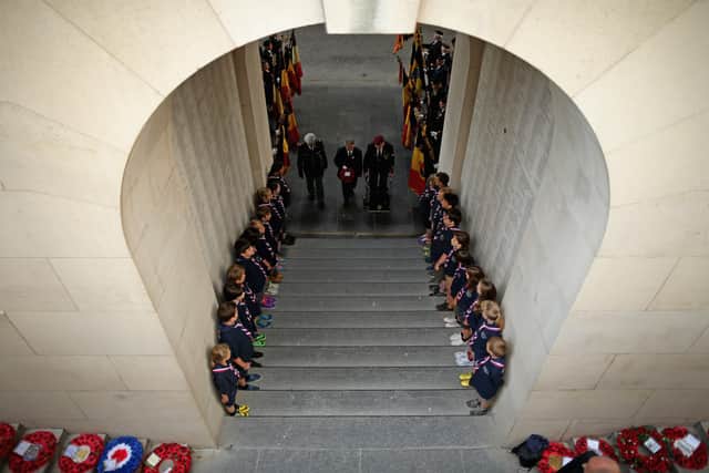 Scouts and cubs at the Menin Gate Memorial to the Missing at Ypres, Belgium (photo: Christopher Furlong/Getty Images) SUS-210211-134032001