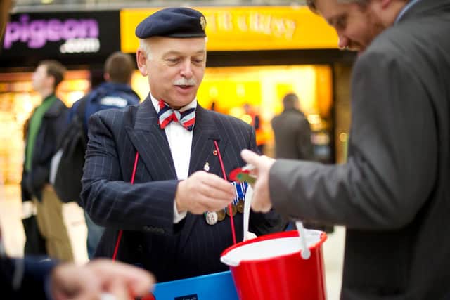 Selling poppies for the poppy appeal  (photo: Bethany Clarke/Getty Images) SUS-210211-134044001
