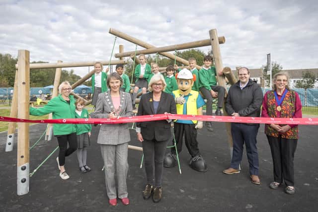 From left: Burgess Hill Town Mayor Anne Eves cutting the ribbon with MSDC Deputy Leader Judy Llewellyn-Burke, Bill Ding, MSDC leader Jonathan Ash-Edwards, Burgess Hill Deputy Mayor Janice Henwood and pupils from Sheddingdean Primary School. Picture: S Saunders/ Digital Nation Photography.